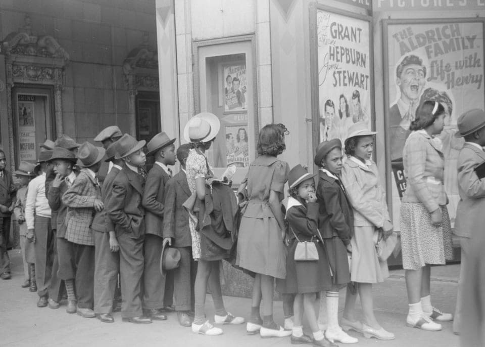 Children waiting outside a movie theatre on Easter Sunday, Chicago, 1941